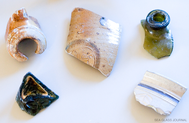 Sea glass and stoneware artifacts from the Roosevelt Inlet Shipwreck.